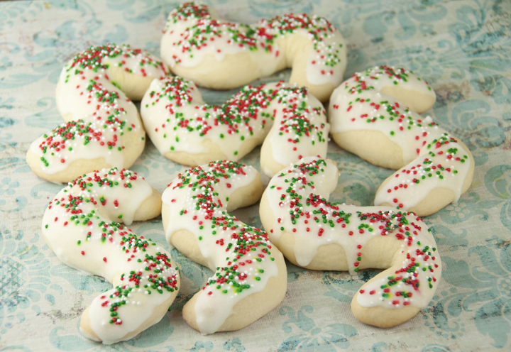 Grandma's traditional Italian recipe for Anisette or "S" cookies. These have white icing and holiday sprinkles and will be the perfect Christmas cookie.