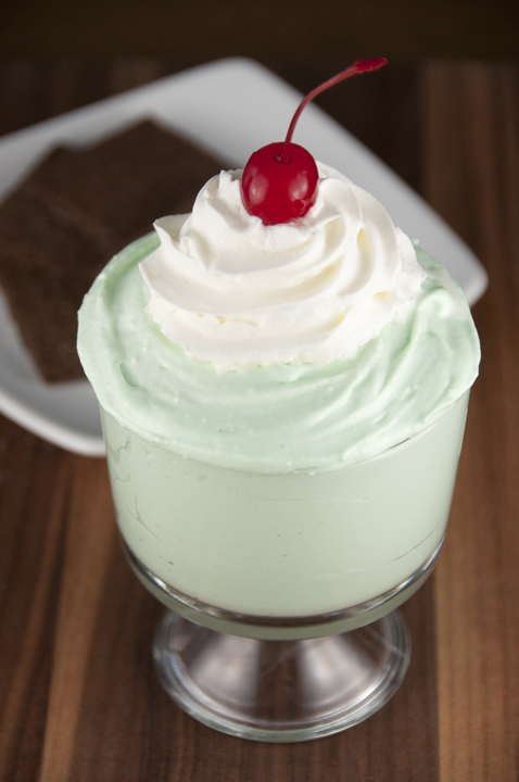 Everyone's favorite minty green milkshake from McDonald's turned into a fun green Shamrock Shake dip dessert recipe to celebrate St. Patrick's Day!