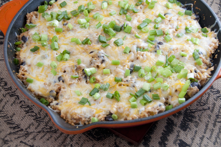 Mexican Chicken Skillet recipe with couscous, black beans, cheese, and chicken.