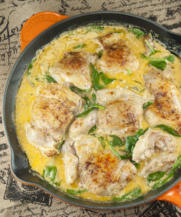 Easy, one skillet dinner recipe idea for tender chicken thighs with the creamy lemon butter sauce poured all over the top.  The delicious sauce is the star of this dish!