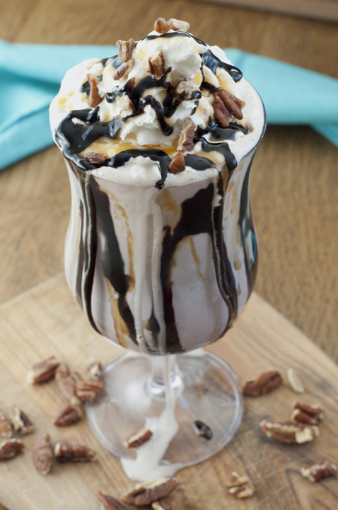 Turtle Coffee Milkshake recipe is brewed coffee, vanilla ice cream and rich chocolate sauce together in a creamy milkshake. It is finished off with a mound of whipped cream, drizzled caramel, chocolate sauce and crushed pecans.