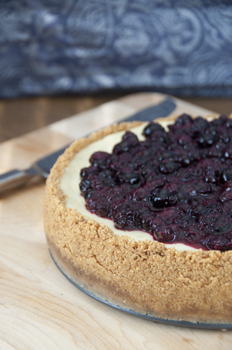 Creamy New York-Style Blueberry Cheesecake recipe with a buttery, thick graham cracker crust and sweet fruit topping. Guests will be begging for seconds!