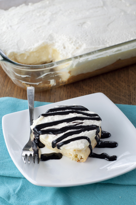 This dessert recipe for Chocolate Eclair Cake is an easy dessert with homemade whipped cream, chocolate syrup, and a cream puff pastry crust.