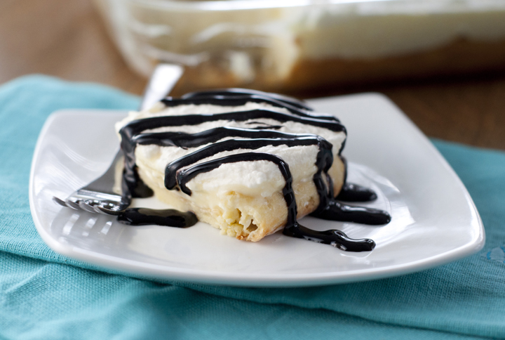 This dessert recipe for Chocolate Eclair Cake, also called "Moon Cake", is your favorite oblong French pastry made into a delicious cake! 