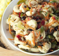 An easy and delicious cold Cheese Tortellini Pasta Salad with Honey Vinaigrette tastes like an Italian antipasto platter and is loaded with veggies for a great side dish recipe.