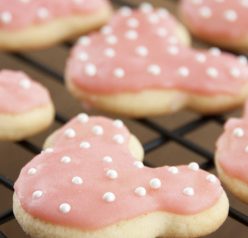 These cute Minnie Mouse sugar cookies are the easiest and the best-tasting sugar cookie recipe - great for a child's Disney themed birthday party! Frost them any way you like, but these will be your new go-to cut-out cookie!