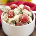This easy, flavorful Italian Marinated Mozzarella Tomato Basil Salad recipe tastes so fresh and is a winning side dish to go with your next meal or bring to a picnic. This salad fits the bill for anytime of the year!
