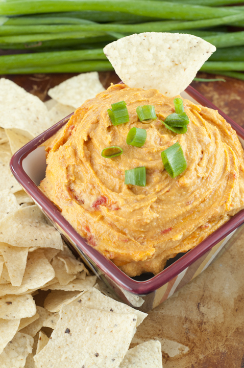  Easy Creamy Red Pepper Cashew Dip recipe is meat and dairy-free, served hot OR cold, and will be a huge hit for your next tailgate or football party this season!
