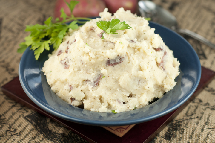 Easy Slow Cooker Buttery Garlic Mashed Potatoes recipe for Thanksgiving, Christmas, Easter or any special occasion dinner.