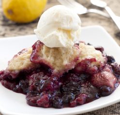 Crock Pot Mixed Berry Cobbler recipe is perfect for the holidays and creates a deeply flavorful dessert with very little prep time!