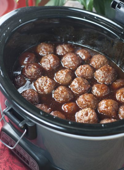 Crock Pot Grape Jelly BBQ Cocktail Meatballs are an awesome recipe for holiday entertaining, Super Bowl party, or pot luck made right in the slow cooker. They are so simple to make and extremely crowd-pleasing!
