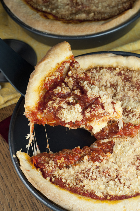 Chicago-Style Deep Dish Pizza is an authentic recipe with a thick, buttery crust, sweet homemade tomato sauce, and plenty of melted mozzarella cheese!