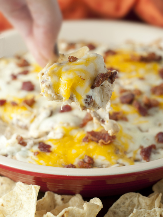 Hot, Cheesy Bacon Cheeseburger Dip recipe is the perfect game day dip snack that has all of your favorite flavors of a bacon double cheeseburger turned into an addicting dip!
