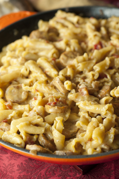 This recipe for Cheesy Chicken Sausage Pasta Skillet is a creamy one pot meal that kids and adults will both love and takes less than a half hour to make!