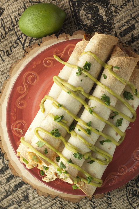 Quick and easy recipe for Slow Cooker Creamy Salsa Verde Chicken Taquitos recipe that is perfect for a main course or appetizer and drizzled with my favorite avocado spread. Great for Cinco de Mayo!