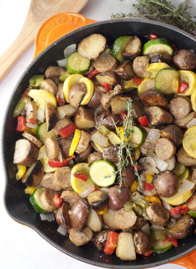 Sizzling Sausage and Potato Summer Vegetable Skillet full of healthy, delicious in-season goodness. This is an easy, fresh side dish recipe or dinner idea!