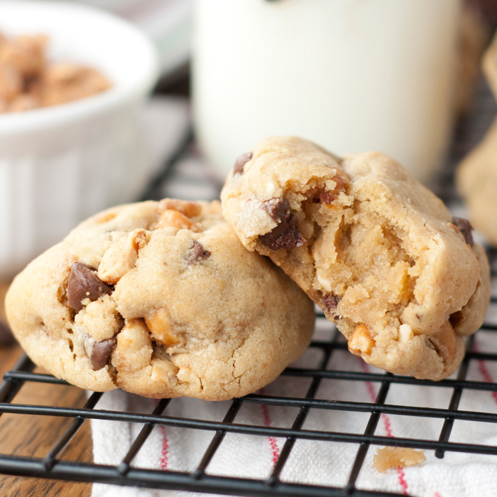 Thick, Chewy Chocolate Chip Peanut Butter Cookies recipe with crushed honey roasted peanuts that you will fall in love with. These are slightly crispy on the edges while gooey and soft on the inside. 