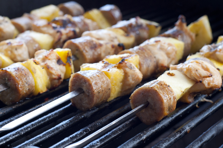 Grilling Healthy Hawaiian Pineapple Chicken Kabobs on Weber Gas Grill in the summer.