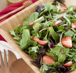 Strawberry Arugula Salad with Honey Lime Vinaigrette recipe is a healthy green salad loaded with fresh fruit and nuts. It is great for picnics and really captures the essence of summer!