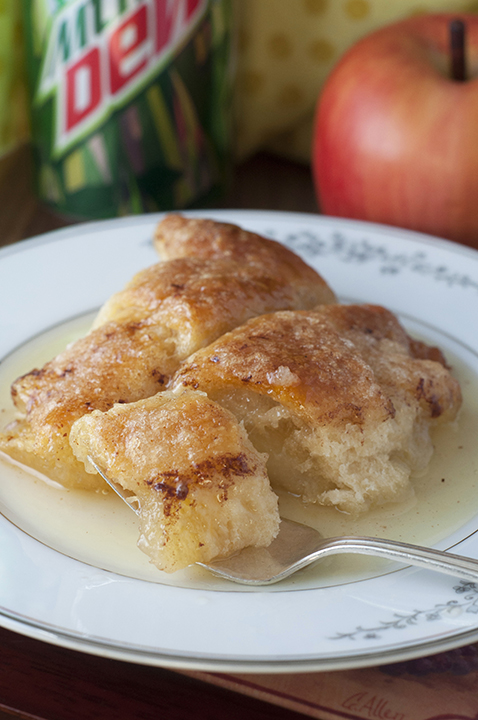 Easy Country Cinnamon Apple Dumplings dessert or breakfast recipe is a classic fall and holiday treat loaded with cinnamon and smothered in a buttery Mountain Dew sauce!