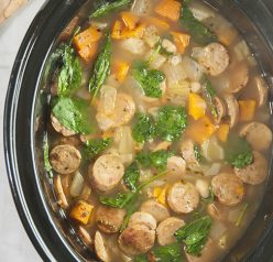 Crock Pot Sausage, Spinach & White Bean Soup is light, healthy, gluten free, and made right in your slow cooker. This is made with chicken sausage and is the perfect lunch or dinner for the cooler weather!