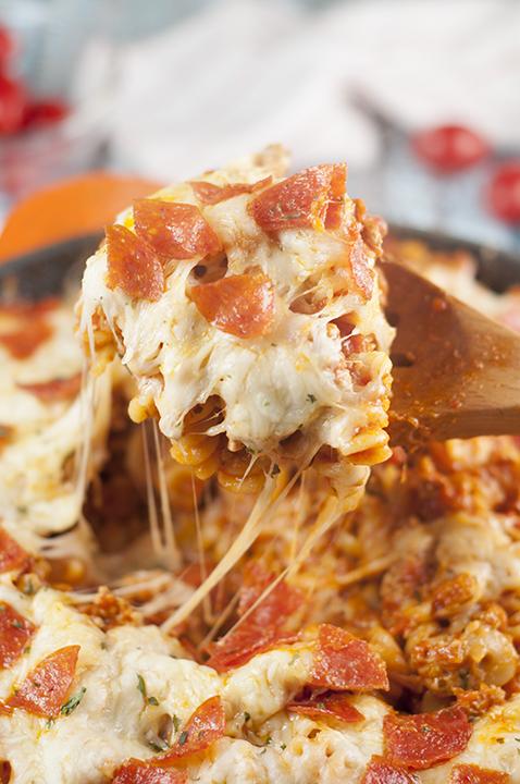 One Pot Pizza Pasta Casserole is an easy, family-friendly, crowd-pleasing recipe that combines two favorites into one! It is all made in one pot for a comforting weeknight meal with fast clean up!