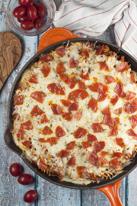 One Pan Pizza Pasta Casserole is an easy, family-friendly, crowd-pleasing recipe that combines two favorites into one! It is all made in one pot for a comforting weeknight meal with fast clean up!