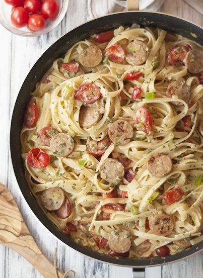One Pan Sausage Pepper Fettuccine Skillet is an easy weeknight dinner pasta recipe made with chicken sausage that's sure to impress your family and dinner guests!
