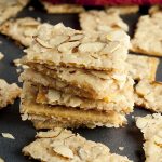 Almond Club Cracker Toffee recipe is salty crackers coated in a sweet toffee sauce and slathered with almonds. This will be your new favorite easy holiday go-to treat!