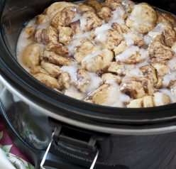 Easy, delicious, Gooey Crock Pot Cinnamon Roll Casserole recipe is sure to be a favorite for breakfast, the holidays or when you want breakfast for dinner! Your family will devour this!