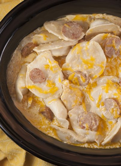 Crock Pot Sausage Pierogi Casserole recipe is a delicious and comforting dish made with chicken sausage and a creamy cheese sauce. Great for potlucks or a weeknight dinner that cooks right in the slow cooker!