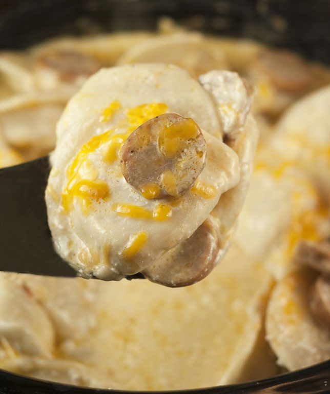 Easy Crock Pot Sausage Pierogi Casserole recipe is a delicious and comfort food dish made with chicken sausage and a creamy cheese sauce. Great for potlucks or a weeknight meal cooked right in the slow cooker!