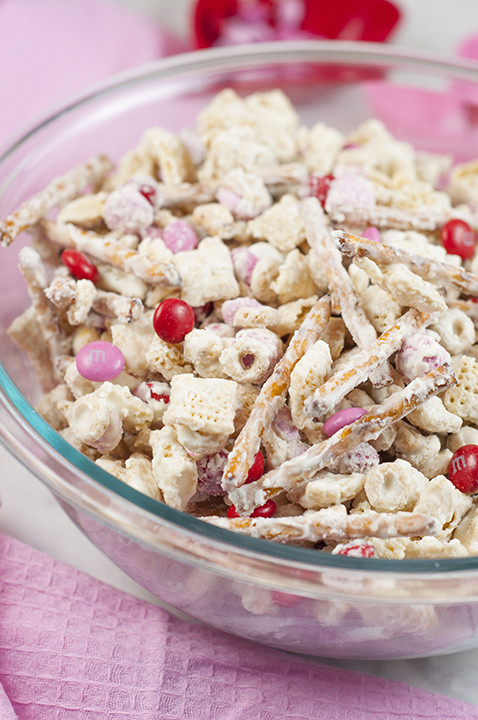 Valentine's Day Cupid's Crunch Chex Mix recipe is a no-bake, sweet and salty snack loaded with red, white and pink M&M's. It's easy to make and makes for great party gifts!