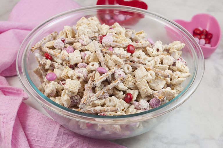 Valentine's Day Cupid's Crunch Chex Mix is a no-bake, sweet and salty snack loaded with red, white and pink M&M's. It's easy to make and makes great gifts!