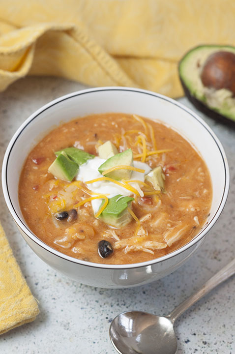 Flavorful and hearty 20 Minute Cheesy Chicken Enchilada Soup recipe is incredibly easy to cook up and full of the BEST flavors. Serve it with tacos and guacamole for Taco Tuesday!