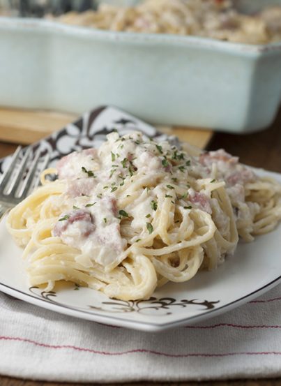 Creamy Baked Ham Fettuccine Alfredo is an easy to make comfort food pasta dish using leftover ham that will leave your family asking for seconds!