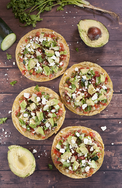 Pine Nut Hummus Pico de Gallo Tostadas recipe topped with an easy, fresh Pico de Gallo and a variety of toppings for a healthy, vegetarian appetizer or snack!