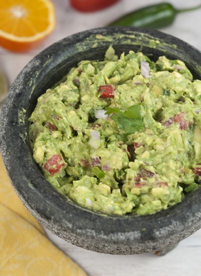 Cinco de Mayo is coming and I'm showing you how to make the best Homemade Ultimate Guacamole recipe that you'll ever have! I learned how to make it using fresh orange juice from a restaurant in San Antonio.