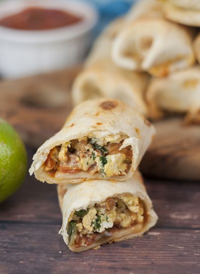 Baked Sausage, Spinach and Egg Breakfast Taquitos are crispy, cheesy, and the perfect easy recipe for a grab-and-go breakfast or "brinner"!