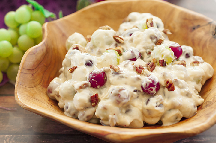 You're just 7 ingredients away from this Creamy Pecan Crunch Grape Salad recipe. It is guaranteed to be a huge hit at office potlucks, picnics, 4th of July, Father's day, holiday dinners and parties!