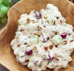 You're just 7 ingredients away from this Creamy Pecan Crunch Grape Salad recipe. It is guaranteed to be a huge hit at office potlucks, BBQ's, holiday dinners and parties!