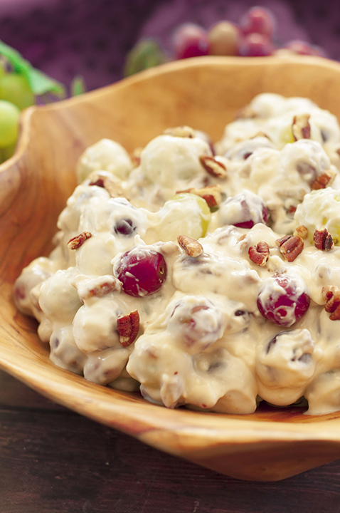 You're just 7 ingredients away from this Creamy Pecan Crunch Grape Salad recipe. It is guaranteed to be a huge hit at office potlucks, picnics, 4th of July, Labor Day, Easter, Father's day, holiday dinners and parties!
