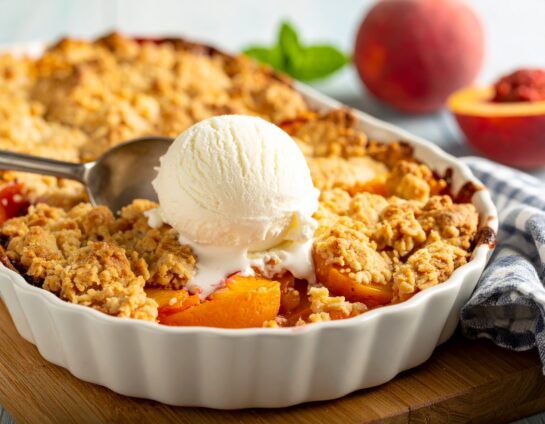 Looking for a simple and delicious Southern dessert? This easy slow cooker peach cobbler is the ultimate comfort food! Made in your crockpot with juicy, sweet peaches, this recipe is perfect for any occasion. Topped with creamy vanilla ice cream, it’s the ideal treat to satisfy your sweet tooth. Just set it and forget it — no baking required!