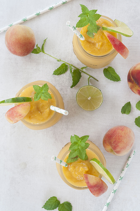 This Alcoholic Frozen Peach Mojito drink recipe is the perfect frozen cocktail on a hot day or for any occasion! These beauties are refreshing, light, and so easy to make.