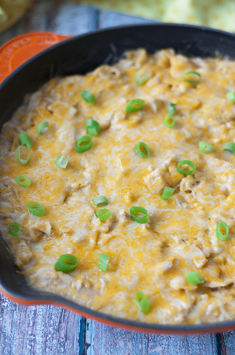 One Pan Sour Cream Chicken Enchilada Skillet recipe made quick and easy in a skillet with corn tortillas pieces, cooked chicken, and a cheesy sauce! Great weeknight meal!