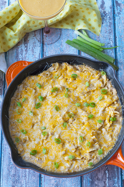 One Pan Sour Cream Chicken Enchilada Skillet recipe made quick and easy in a skillet with corn tortillas pieces, cooked chicken, and a cheesy sauce! 