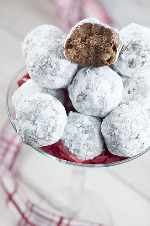Easy Holiday Christmas Rum Balls are sweet, dense, and the perfect addition to your holiday dessert trays! This traditional recipe will have all of the adults raving!