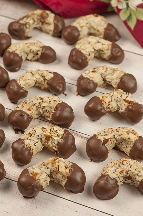 Traditional Italian Chocolate-Dipped Almond Horns recipe - horseshoe-shaped crescent cookies that are moist and chewy on the inside with a crunchy almond texture on the outside.