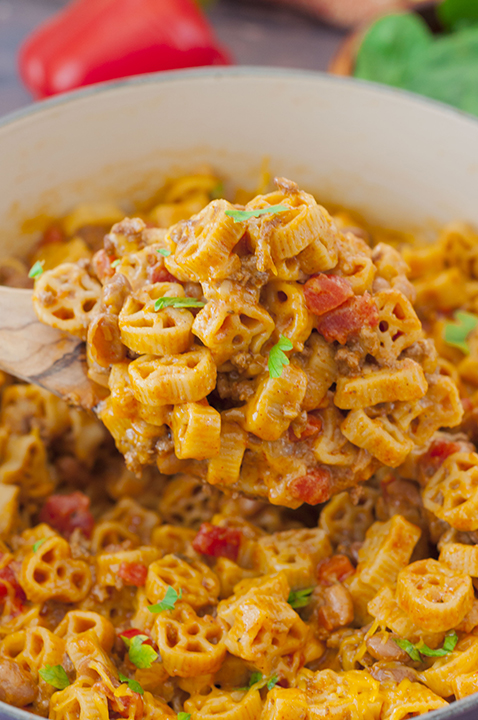 Easy One Pot Chili Mac and Cheese combines two of my favorite foods: mac 'n cheese and chili. You get the best of both worlds with this hearty dinner with gooey cheese that takes less than a half hour to make!