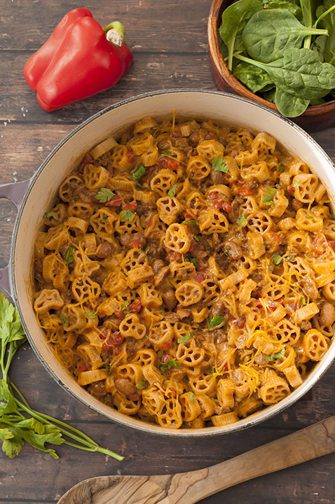 Easy One Pot Chili Mac and Cheese combines two favorite childhood foods: mac 'n cheese and chili. You get the best of both worlds with this hearty dinner with gooey cheese that takes under 30 minutes to throw together!